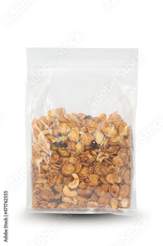 Caramel cornflakes in plastic bag package isolated on white.