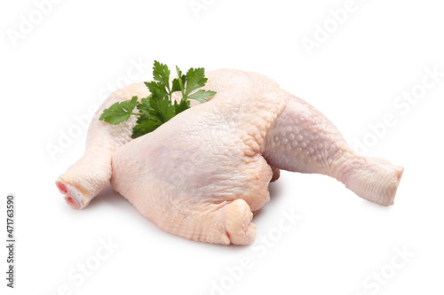 Raw chicken leg quarters with parsley on white background photo
