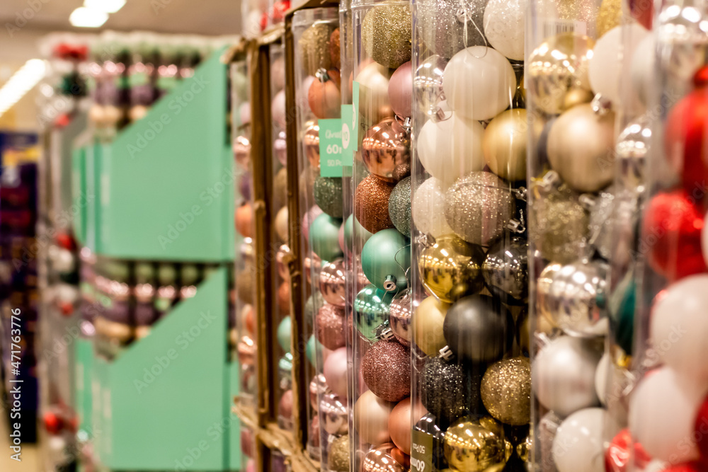 Various christmas ornaments balls baubles in plastic boxes. Christmas shopping concept. Holidays retail sale