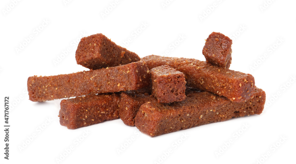Pile of delicious crispy rusks on white background Pile of delicious crispy rusks on white background