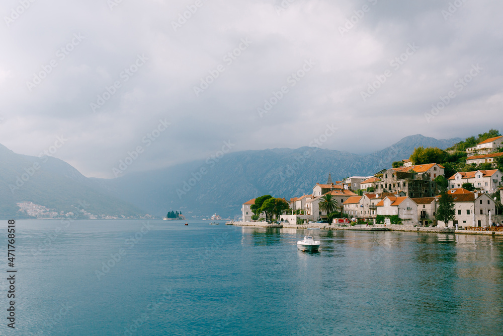 Boat sails past the coast of Perast. Montenegro