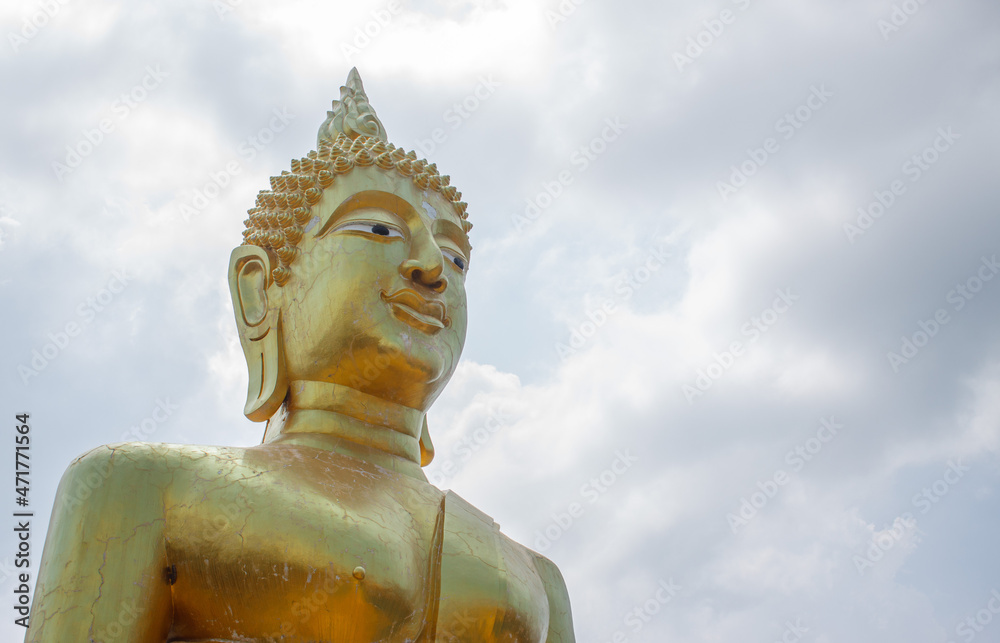 golden buddha against the sky