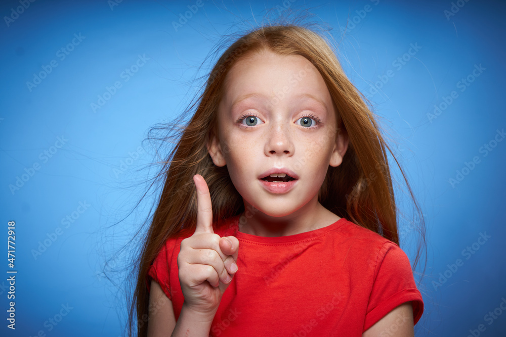 cheerful cute red-haired girl childhood blue background cheerful cute red-haired girl childhood blue background