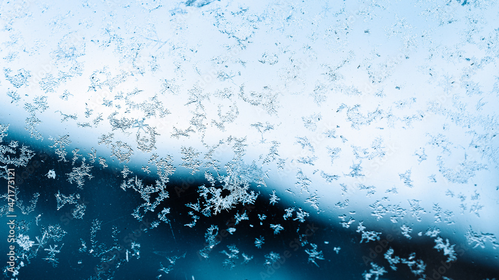 Frosting macro. Cold snow winter background. Blue crystal frozen abstract pattern. White frost ice texture.