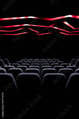 Concert hall, cinema hall with switched off lights and soft seats.