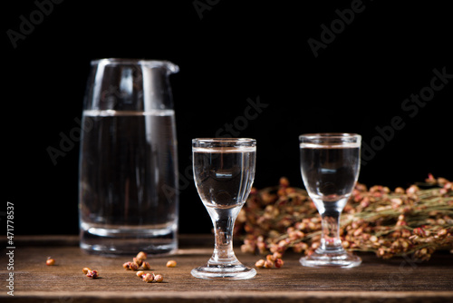 chinese liquor or spirits in glass cup on table