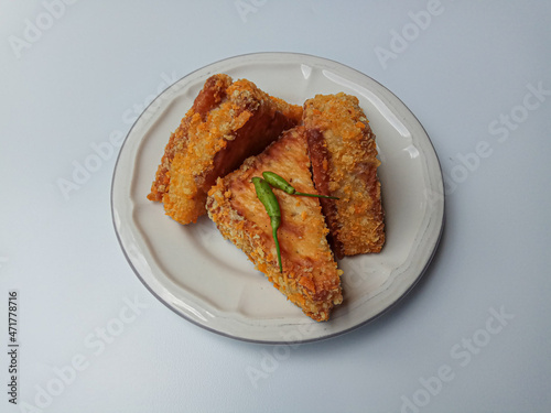 Fried crackers filled by ragout, vegetarian snack popular in Indonesia. Isolated on white background. photo