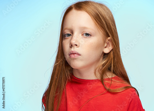 girl with red hair posing red t-shirt childhood
