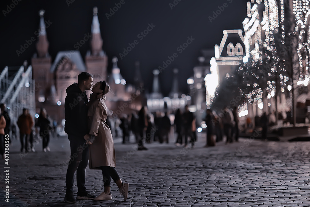 couple in love in moscow night winter, young family evening in winter moscow, autumn style