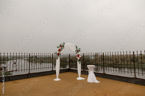 wedding arch and rose petals