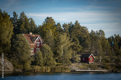 Obraz na plátně Old traditional red fisherman summer house in Sweden