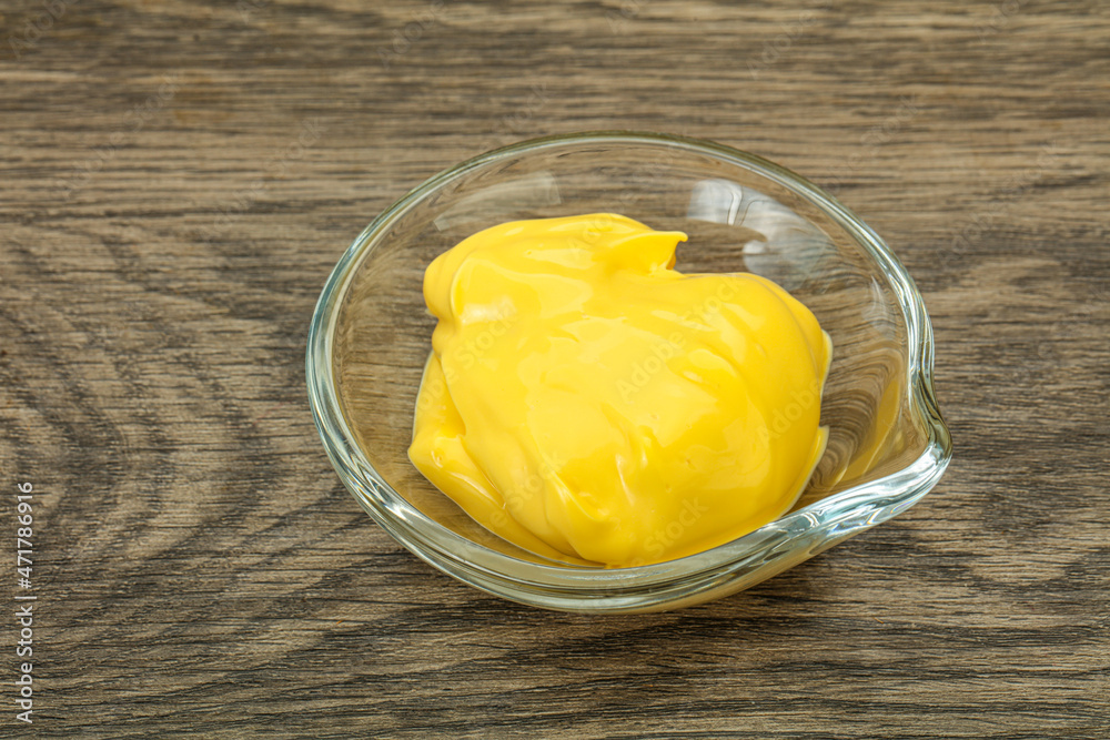 Natural cheese sauce in the bowl Natural cheese sauce in the bowl