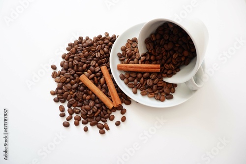 Coffee beans, Cinnamons and cup and saucer on white background. Cafe, Coffee, restaurant design elements. 