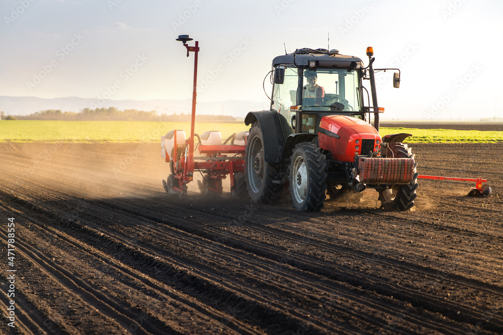Sowing crops at agricultural fields in spring Sowing crops at agricultural fields in spring