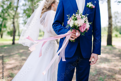 newlyweds hold hands with all their love