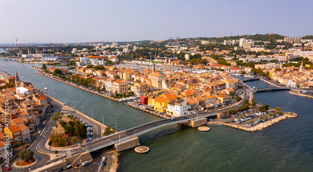 Aerial view of Provencale Venice, French seaside town of Martigues on Mediterranean coast overlooking old districts on banks of canals and marina in summer