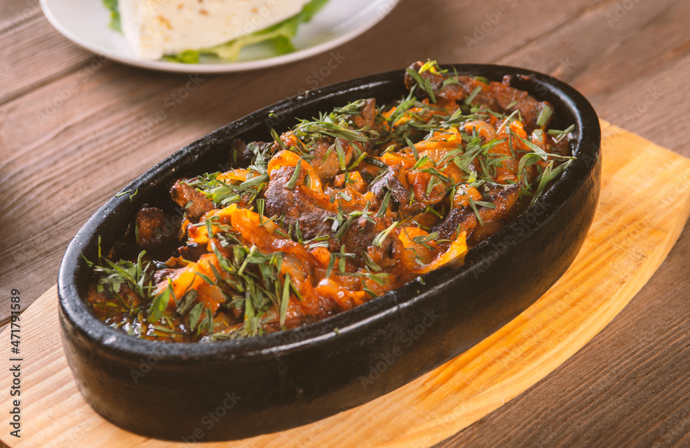 Korean spicy food on a plate,meat with vegetables and onion