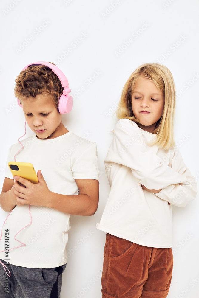 Portrait of his he her looking at the phone posing lifestyle childhood Portrait of his he her looking at the phone posing lifestyle childhood
