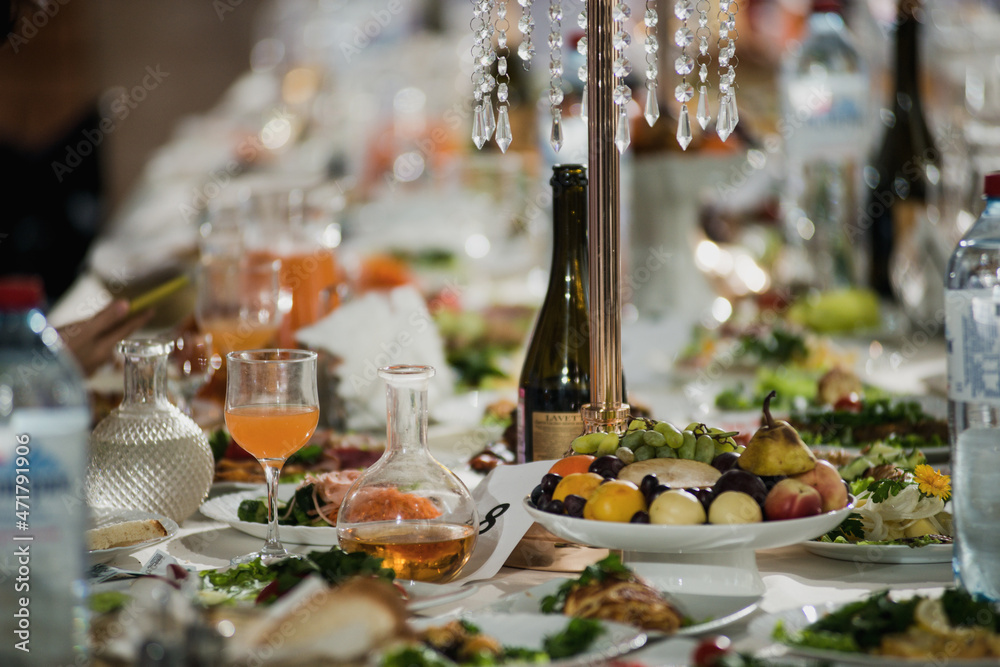 beautifully set table at a wedding banquet with delicious food and alcohol