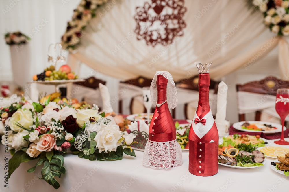 beautifully set table at a wedding banquet with delicious food and alcohol