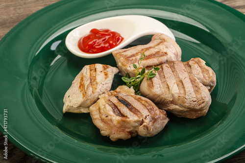 Grilled pork tenderlion with tomato sauce photo