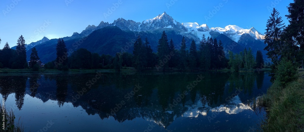 Mountains mirroring in the lake on a summer morning, Chamonix, France