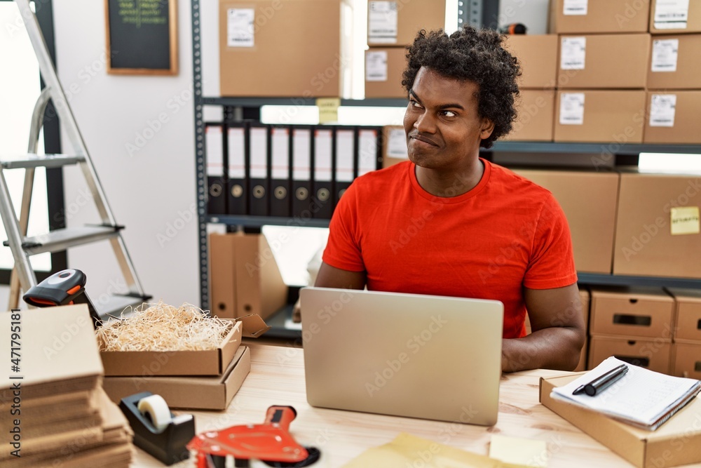 Young south east man smiling confident working at storehouse Young south east man smiling confident working at storehouse
