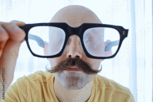 big vintage mustache man, glasses man portrait, unusual look © kichigin19