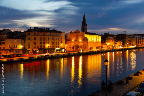 Picturesque streets with backlit village of Martigues at night. France