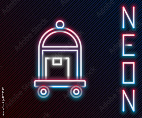 Glowing neon line Hotel luggage cart with suitcase icon isolated on black background. Traveling baggage sign. Travel luggage icon. Colorful outline concept. Vector