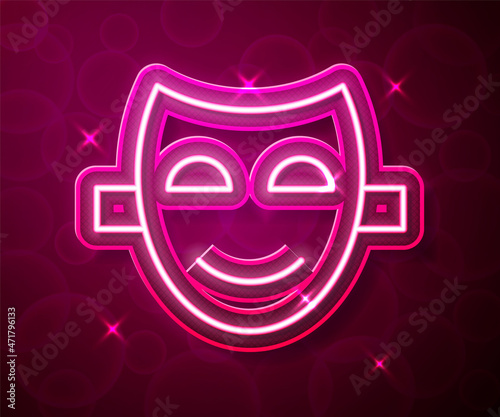 Glowing neon line Comedy theatrical mask icon isolated on red background. Vector