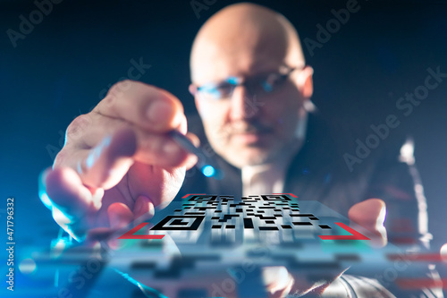 Businessman demonstrates QR...