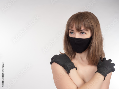 Woman in reusable protectiv...