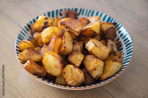 Roasted potatoes served in bowl