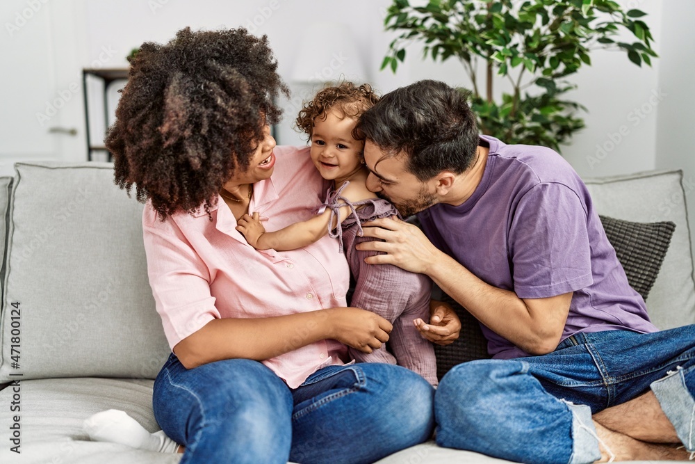 Couple and daughter smiling confident hugging each other at home Couple and daughter smiling confident hugging each other at home