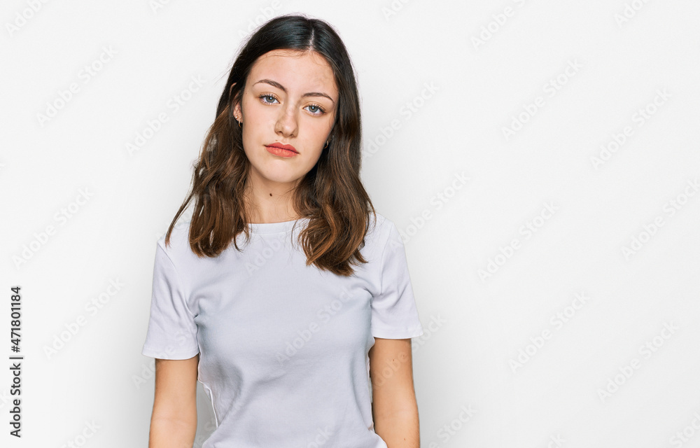 Young beautiful woman wearing casual white t shirt looking sleepy and tired, exhausted for fatigue and hangover, lazy eyes in the morning. Young beautiful woman wearing casual white t shirt looking sleepy and tired, exhausted for fatigue and hangover, lazy eyes in the morning.
