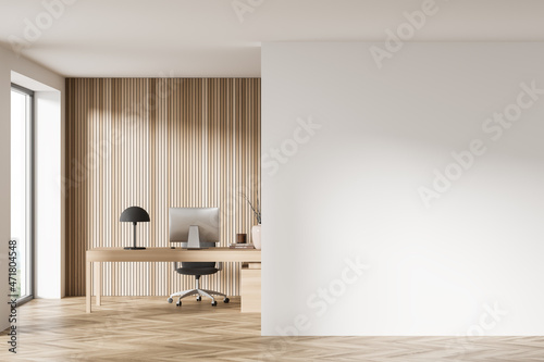 Workplace interior with table and computer on parquet floor. Mockup