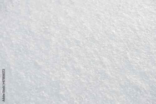 The surface of a fluffy snowdrift on a winter day