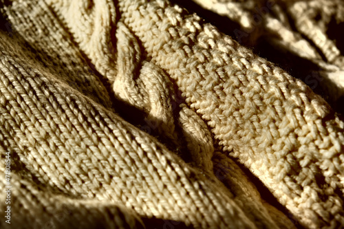 Grunge background with Knitted fabric pattern texture closeup. noise and grain effect and high contrast