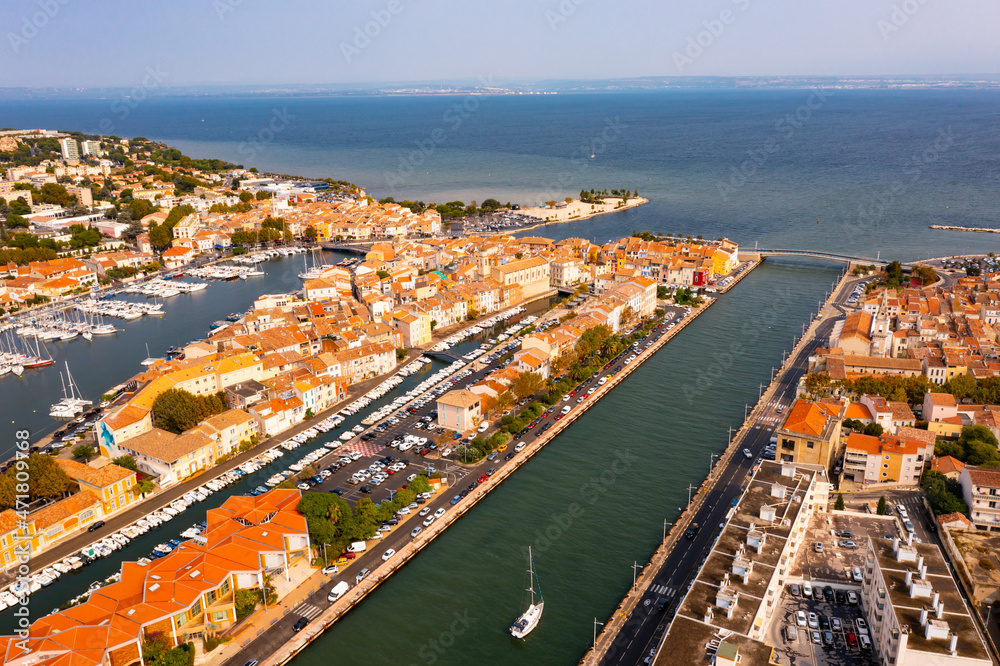 Aerial view of Provencale Venice, French seaside town of Martigues on Mediterranean coast overlooking old districts on banks of canals and marina in summer