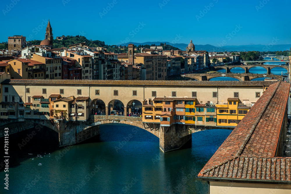 A view of Ponte Vecchio in Florence during a sunny autumn day