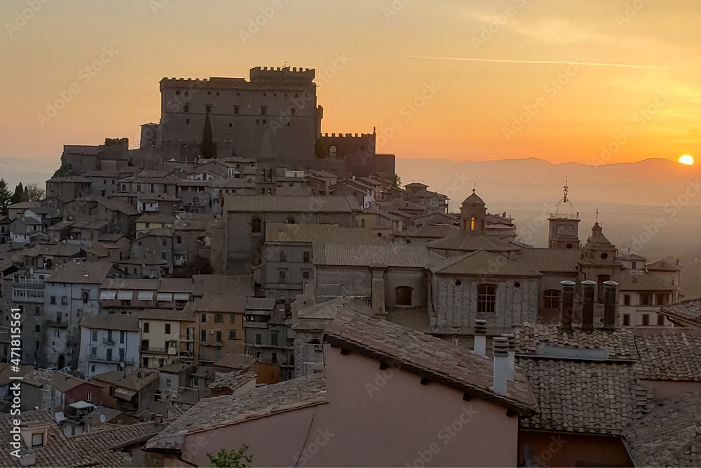 Castle in the background and surrounding village during morning sunrise.
Village is Soriano Nel Cimino in the Tuscany area of Italy. 