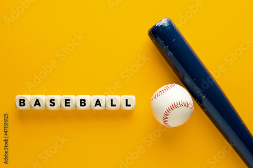 Wall Mural Baseball ball and blue wooden bat on yellow background with the word baseball