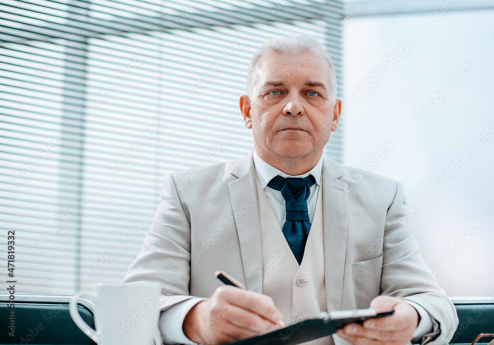 business man sitting at a table in a cafe business man sitting at a table in a cafe
