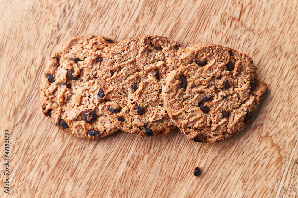 Delicious chocolate cookies on a wooden table Delicious chocolate cookies on a wooden table