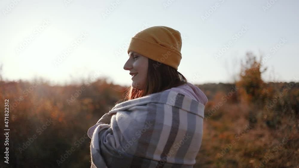 Happy free woman wearing yellow hat and cozy clothes with cashmere scarf has fun outdoors in autumn park, having fun Happy free woman wearing yellow hat and cozy clothes with cashmere scarf has fun outdoors in autumn park, having fun