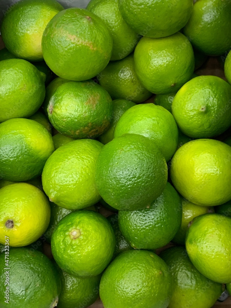 lots of sour green limes for eating as a background