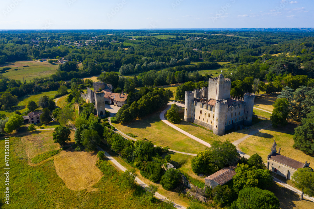 Picturesque summer landscape with imposing medieval Roquetaillade Castle in French commune of Mazeres, Gironde