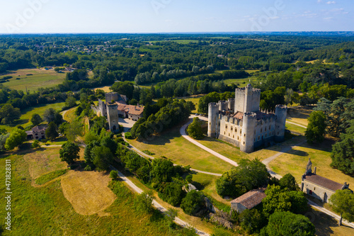 Picturesque summer landscape with imposing medieval Roquetaillade Castle in French commune of Mazeres  Gironde