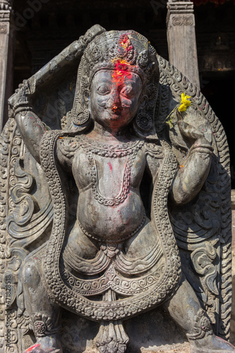 Statue of a Hindu God at the Uma Maheshwor temple in Kirtipur, Nepal photo